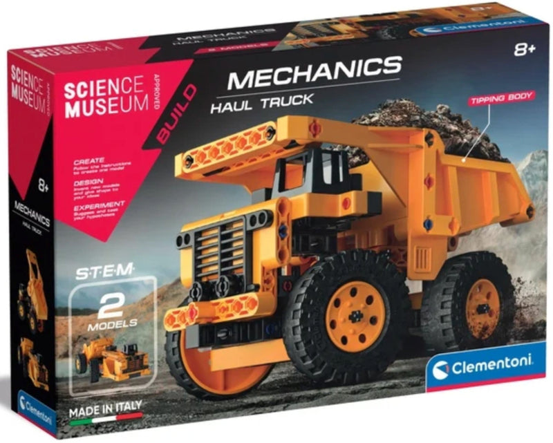 Clementoni Science Museum Build Mechanics Haul Truck toy set in its retail packaging, featuring a large orange and black construction truck illustration on a dark box with product details and age 8+ marking.