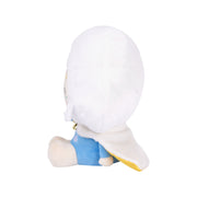 White plush character with blue shorts sitting on plain background