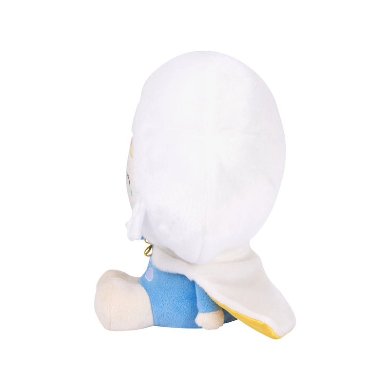 White plush character with blue shorts sitting on plain background