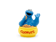 Blue Cookie Monster Tonie figurine sitting in yellow cookie jar with scattered cookie crumbs