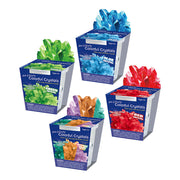 Four colorful crystal growing kits showing blue, green, red, and multi-color varieties with grown crystals