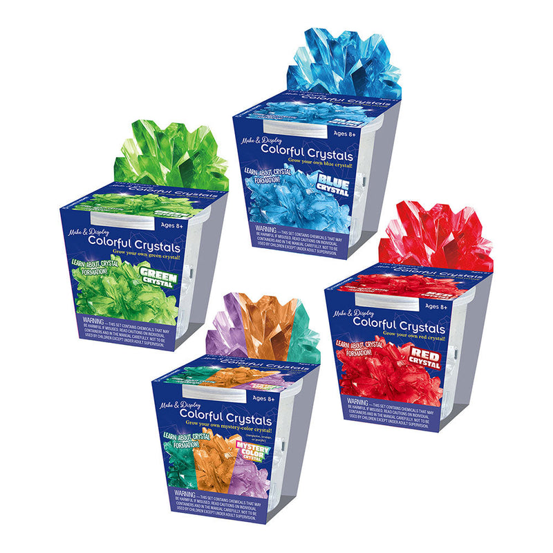 Four colorful crystal growing kits showing blue, green, red, and multi-color varieties with grown crystals