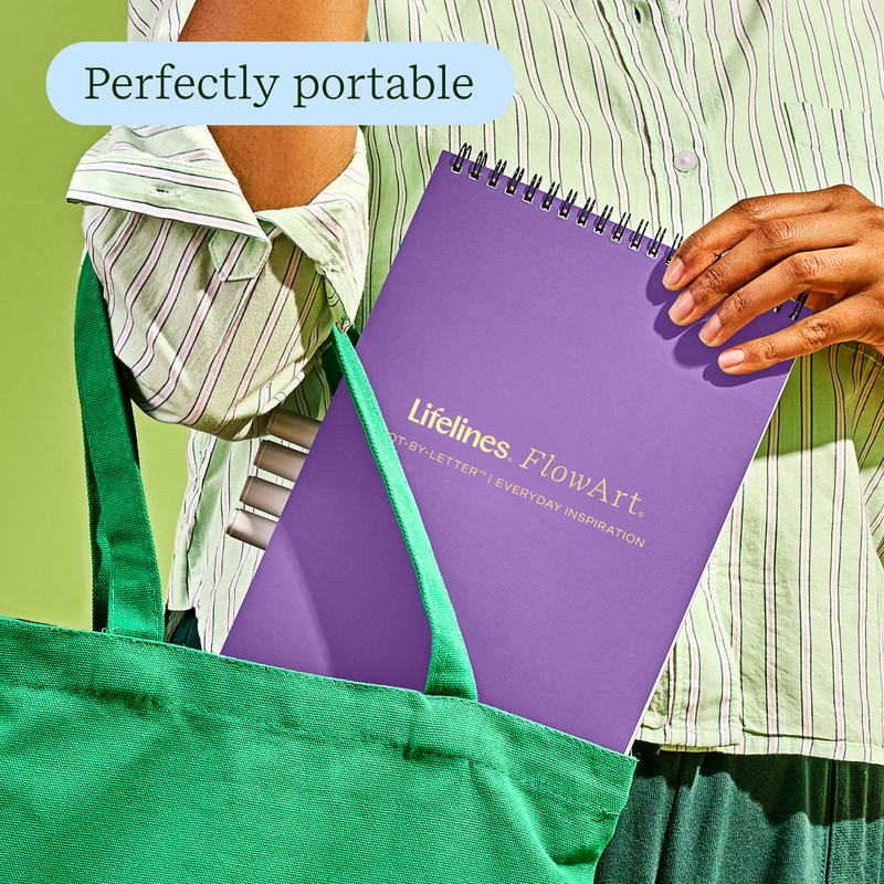 Purple Lifelines FlowArt dot-by-letter notebook shown in green tote bag with perfectly portable text overlay