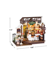 Miniature dollhouse coffee shop with detailed interior furniture and accessories showing dimensions