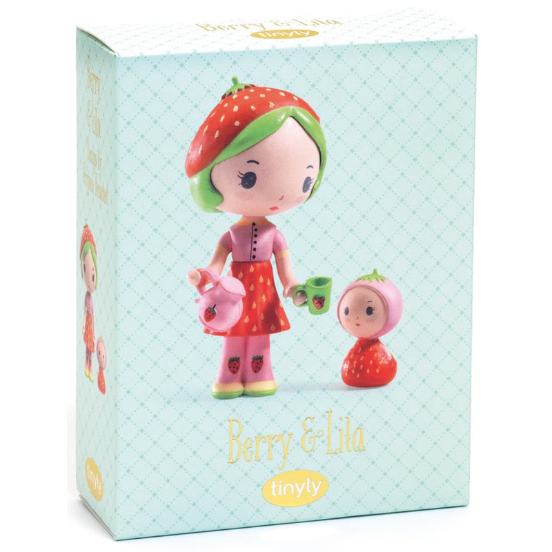 A boxed collectible figurine set from Tinyly, featuring Berry & Lila. The packaging is a light mint green box with a subtle diamond pattern, displaying illustrations of the two characters: one with strawberry-themed hair and clothing holding a pink teapot, and the other in a pink bonnet with a red strawberry dress.