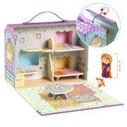 A children's dollhouse set in a carrying case with pastel purple trim, shown open to reveal a furnished interior with shelves, bed, rug, and small table. An inset shows the house roof detail, and a small doll figure with a height measurement is pictured on the right.