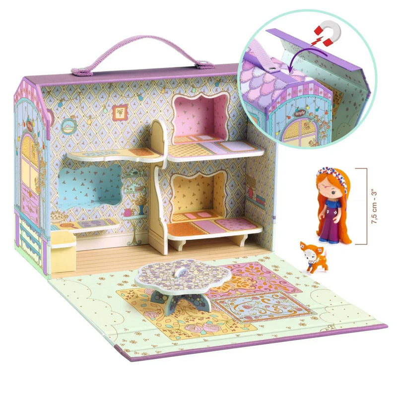 A children's dollhouse set in a carrying case with pastel purple trim, shown open to reveal a furnished interior with shelves, bed, rug, and small table. An inset shows the house roof detail, and a small doll figure with a height measurement is pictured on the right.