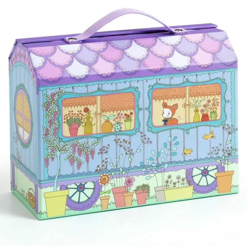 A decorative purple and pastel blue playset box with a handle, featuring a whimsical garden and house illustration on the front.
