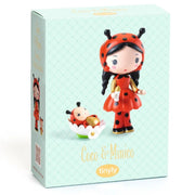 A boxed collectible figurine set labeled 'Coco & Mimico' by Tinyly, shown against a plain white background. The packaging is pale mint green with a subtle diamond pattern and features illustrations of a ladybug character and the figurine itself.