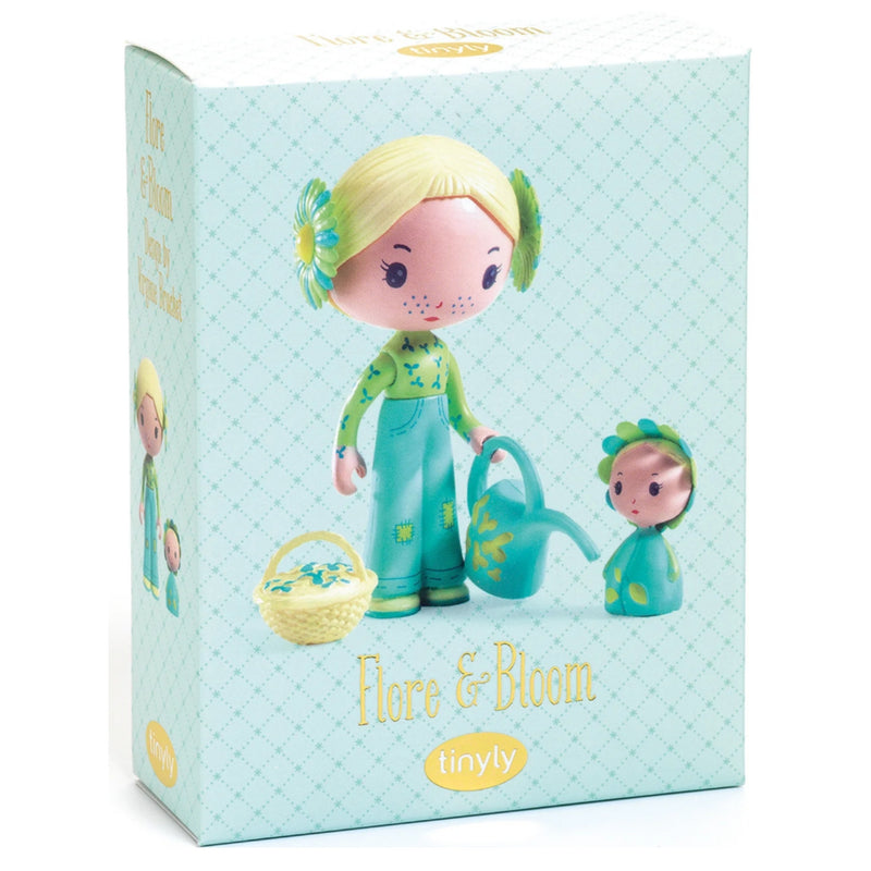 Tinyly 'Flora & Bloom' doll set in its original packaging, featuring a blonde doll in green overalls holding a watering can and next to a small doll, on a white background.