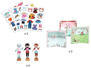 A children's play set shown on a white background, including three sheets of colorful clothing and accessories, three wooden character figures, and three illustrated play mat or scene pieces. Small 'x 3' labels indicate quantity.