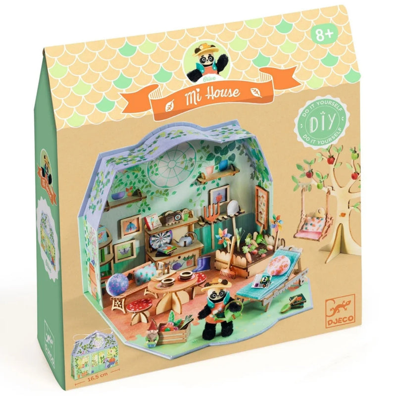 A boxed children's DIY wooden house toy set by Djeco, shown in its retail packaging on a white background. The box features a colorful printed illustration of a panda running through a detailed miniature room with shelves, bed, desk, and treehouse elements.