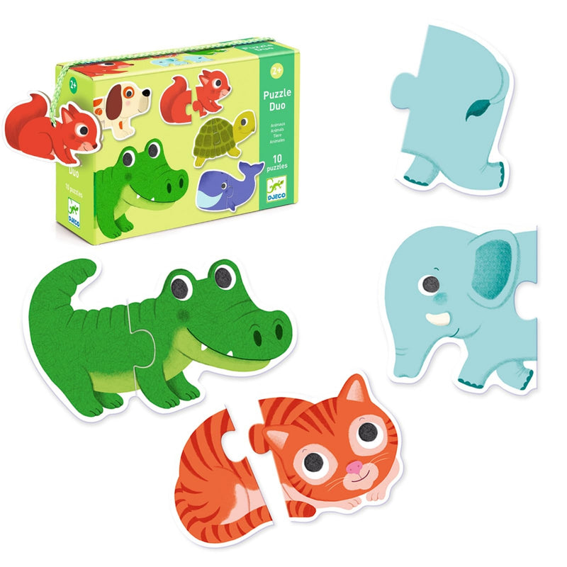 A children's wooden puzzle set shown with its box and several animal puzzle pieces on a white background. The set includes a green crocodile, a blue elephant, an orange-and-white cat, and a light blue elephant piece.