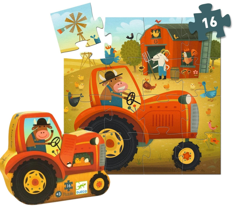 A children's jigsaw puzzle and matching toy tractor set on a white background. The main puzzle shows a farm scene with an orange tractor, barn, farmer, chickens, ducks, and a windmill, with a missing piece highlighted in the top right.