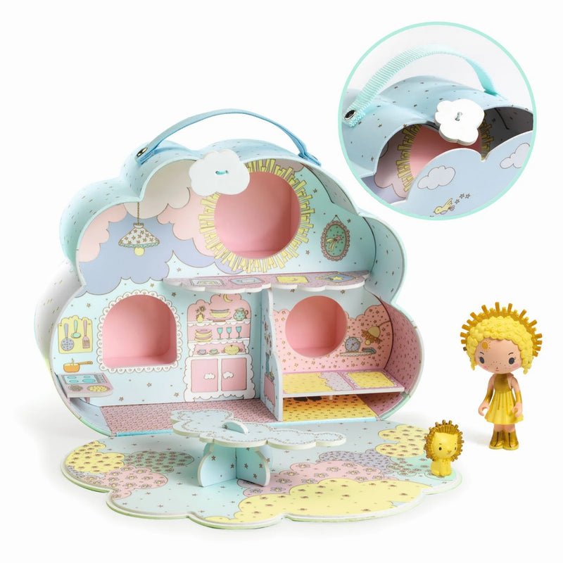Toy house set with a girl figure and little lion toy on a white background.