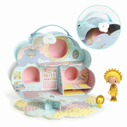 Toy house set with a girl figure and little lion toy on a white background.