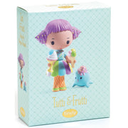 A boxed collectible figure from Tinyly, featuring the character Tutti & Frutti on a pale aqua patterned box. The front shows a stylized purple-haired girl holding ice cream cones next to a small blue creature, with the brand name Tinyly visible at the bottom.