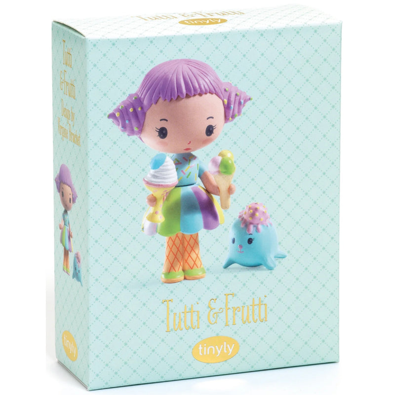 A boxed collectible figure from Tinyly, featuring the character Tutti & Frutti on a pale aqua patterned box. The front shows a stylized purple-haired girl holding ice cream cones next to a small blue creature, with the brand name Tinyly visible at the bottom.