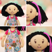 Groovy Girls Daisy doll with black yarn hair, pink highlights, and floral overalls