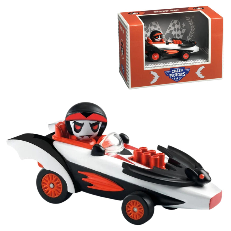 A toy go-kart vehicle with a cartoon driver figure, shown alongside its retail packaging box. The go-kart is primarily white and black with bright orange wheels and accents, and the driver figure wears a black and red helmet.