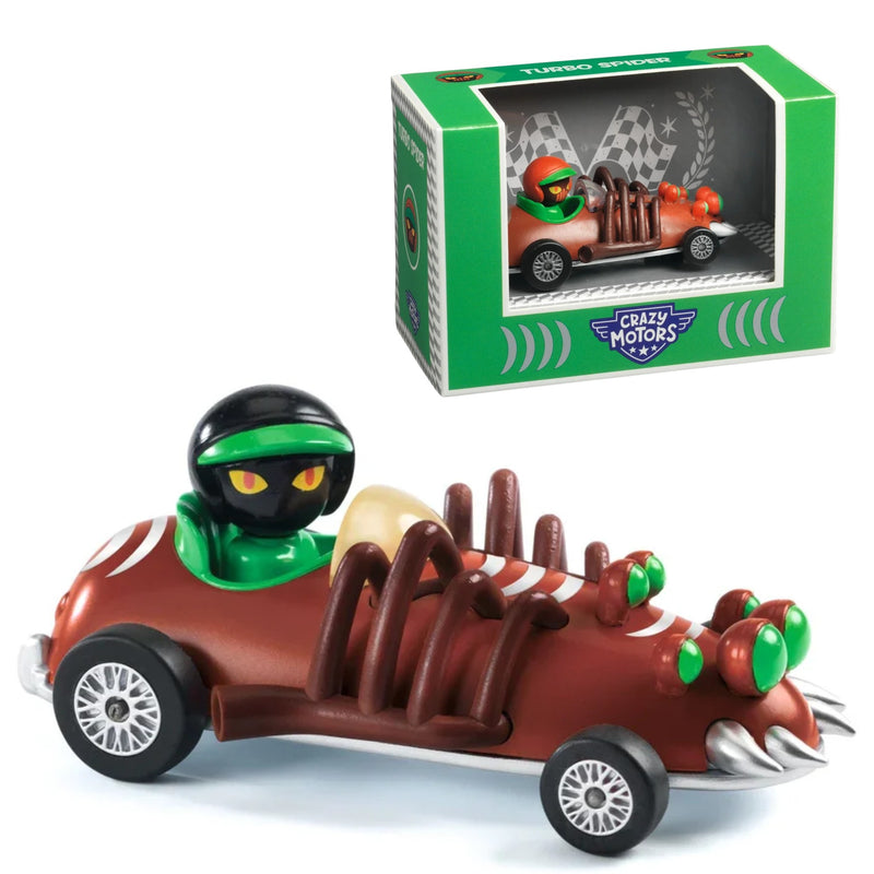 A toy race car that looks like a spider with a driver figure inside, shown alongside its green and white Crazy Motors Turbo Spiders box on a white background.