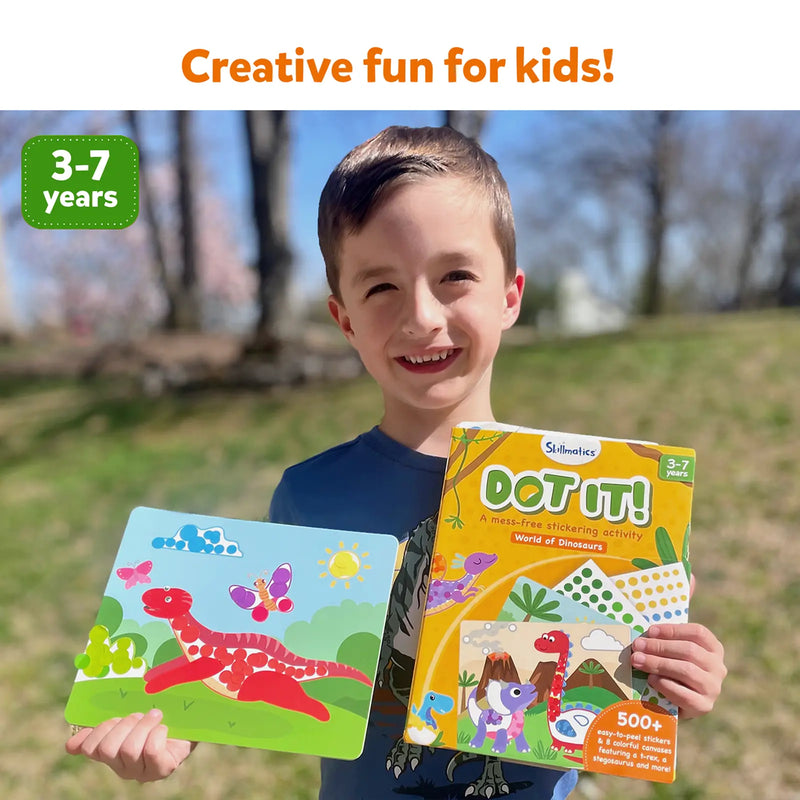 Child holding Dot It World of Dinosaurs sticker activity book and completed dinosaur scene