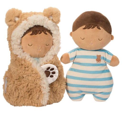 A soft plush baby doll and matching teddy bear hooded cushion or pillow set on a plain white background. The doll wears a blue-and-white striped onesie and has brown hair, while the plush bear figure is tan with cream trim and holds a white paw-shaped accent.