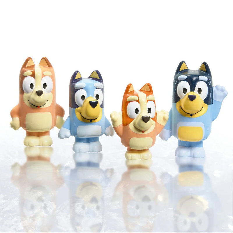 Four colorful Bluey character squirter toys arranged on reflective white background