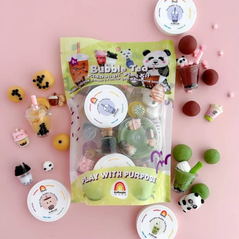 Bubble tea-themed dough play set with packaging on a pink background.