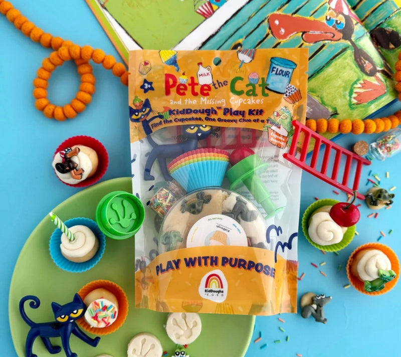 Bagged Pete the Cat Earth Grown KidDoughs play kit.  Contents are spread around the outide of the package.  Picture is on a blue background.