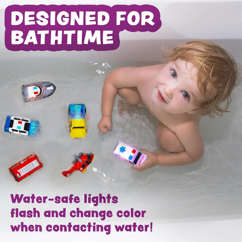 Child playing in a bathtub with colorful emergency toy cars, surrounded by water-safe lighted toys from TubWorks.