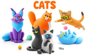 A group of colorful, Hey Clay stylized cat figurines and toy balls on a plain white background, with the word "CATS" in large orange letters at the top.