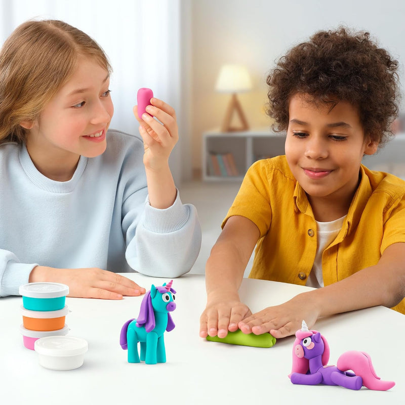 Two kids using the product and making unicorns.  One is rolling green clay and the other is working with pink.  