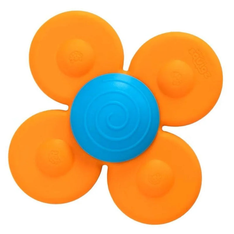 A flower-shaped baby teether or sensory toy with four bright orange petals and a blue spiral center, shown on a plain white background.