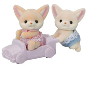 Brother & Sister Fennec Fox toys from Calico Critters in small pretend car on white background.