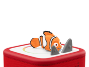 Orange clownfish Tonie figure on red Toniebox speaker with shark fins