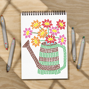 Notebook with a completed colorful dot-style drawing of a watering can and flowers on a wooden surface with markers.