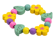 Completed colorful wooden bead flower bracelet from Cotton Twist on a white background.