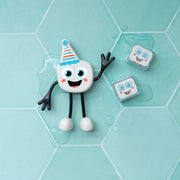 Glo Pals Party Pal character with party hat and ice cubes on hexagonal tiles