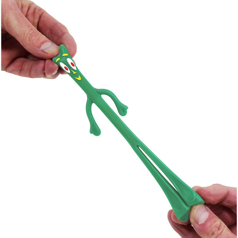 Hands stretching green Gumby toy figure showing its flexible bendable properties