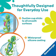 Explains that a green lizard-shaped rattle with suction cups and text about its features and brand.