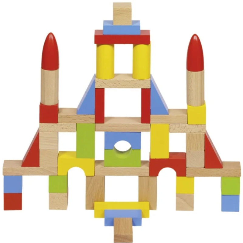 A colorful wooden block tower toy structure made of natural wood blocks and painted pieces in red, yellow, blue, green, and light wood, arranged symmetrically on a plain white background.