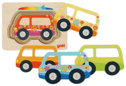 A set of colorful wooden toy cars and a matching wooden puzzle board on a plain white background. The brand name 'goki' is visible on the puzzle board.