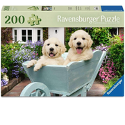Ravensburger puzzle box with two puppies in a wheelbarrow and garden background