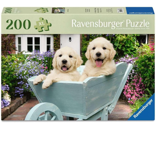 Ravensburger puzzle box with two puppies in a wheelbarrow and garden background