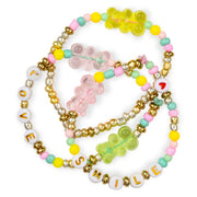 Colorful beaded bracelets with gummy bear charms and letter beads spelling LOVE and SMILE