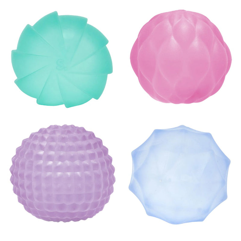 Four textured balls in teal, pink, purple, and blue on a white background