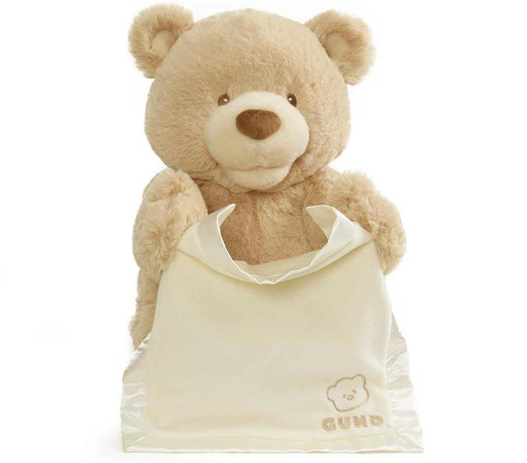 GUND animated Peek-A-Boo Bear plush holding a cream satin blanket