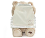 GUND Peek-A-Boo Bear plush with its cream blanket raised over its face