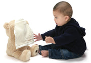 Baby playing peek-a-boo with GUND animated Peek-A-Boo Bear plush